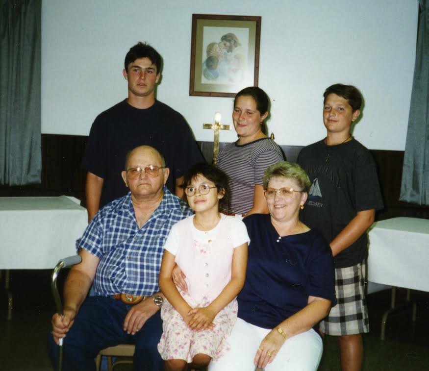 A photo of my grandfather, grandmother, and the other grandchildren taken when I was about six years old