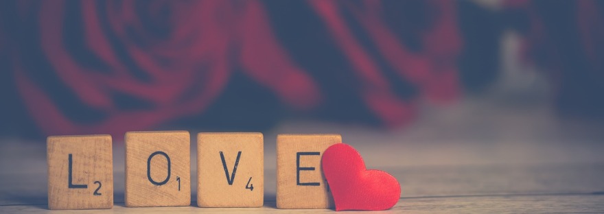 Scrabble squares spell the word, "Love."